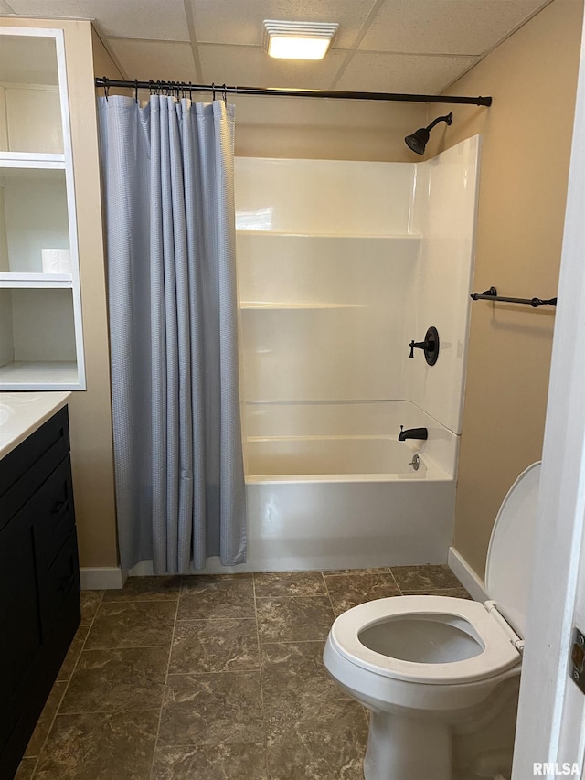 bathroom with vanity, shower / bath combo, and a drop ceiling