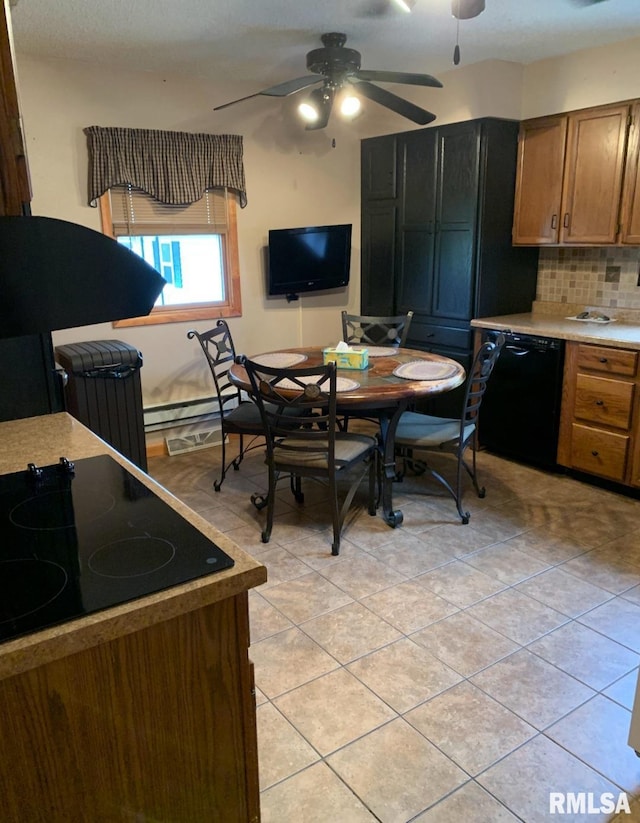 kitchen with tasteful backsplash, light tile patterned floors, baseboard heating, ceiling fan, and black appliances