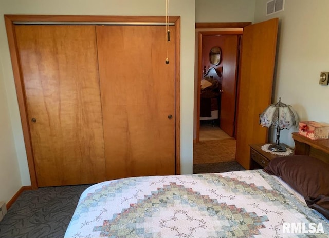 carpeted bedroom with a closet