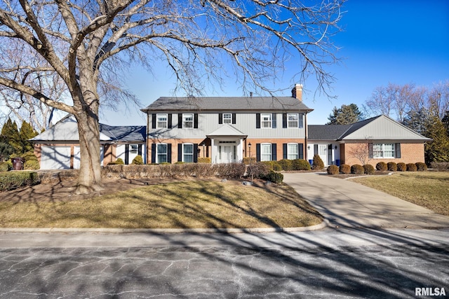 colonial inspired home with a front yard