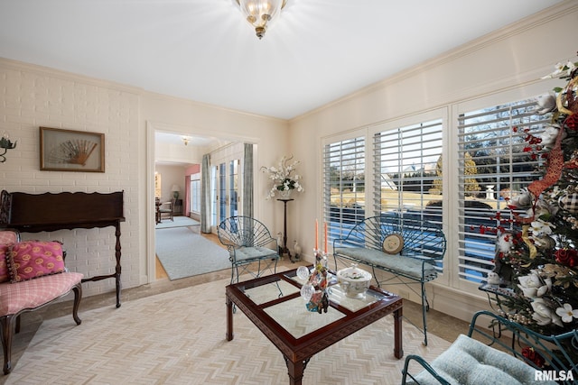 living area featuring crown molding and light carpet