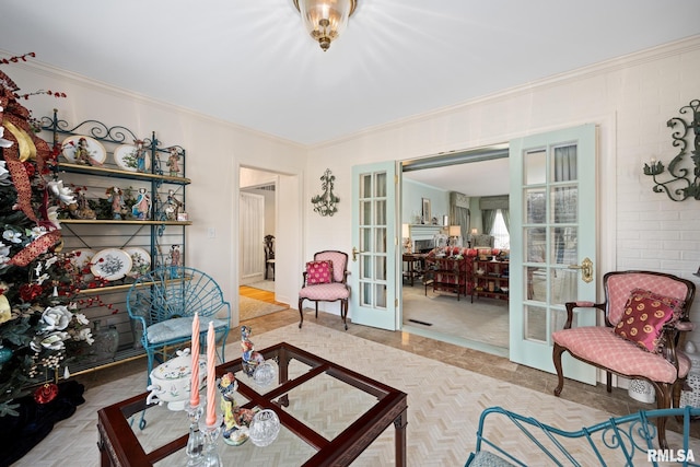 living room with french doors and crown molding