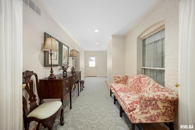 living area featuring carpet floors and ornamental molding