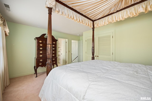 carpeted bedroom featuring a closet