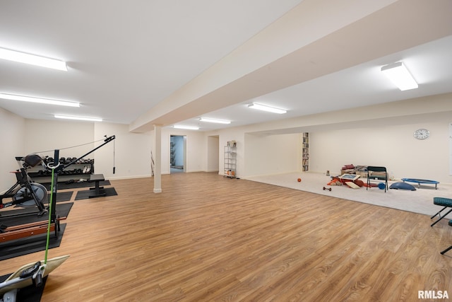 workout room featuring light wood-type flooring