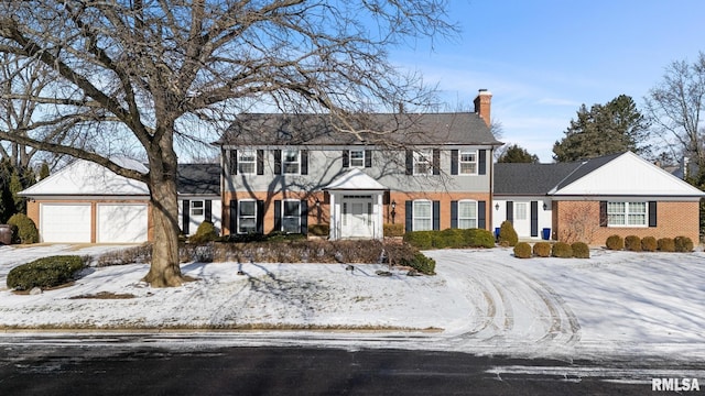 colonial house featuring a garage