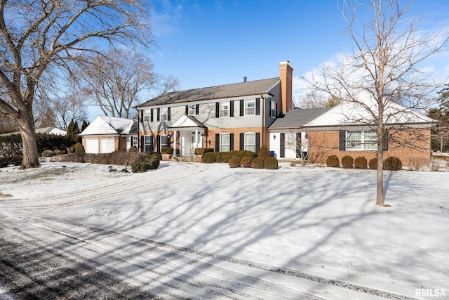 colonial home with a garage