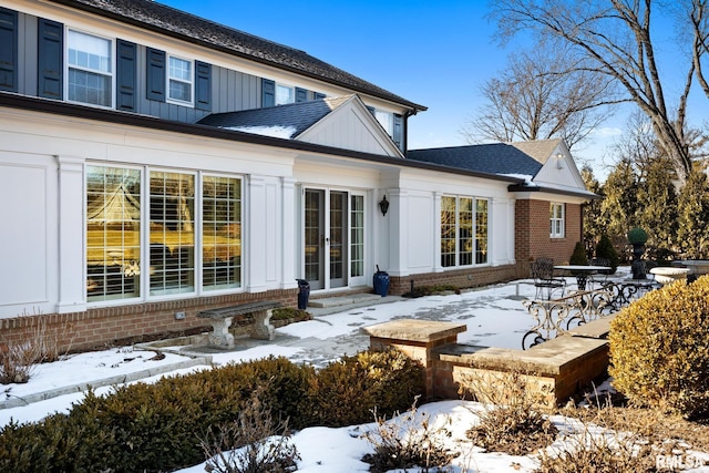 view of snow covered house