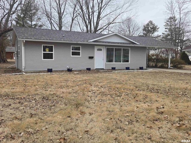 ranch-style home with a carport and a front lawn