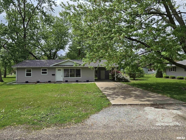 104 Parkway Dr, Carthage, IL 62321 - ranch-style home with concrete driveway, a front yard, and a carport