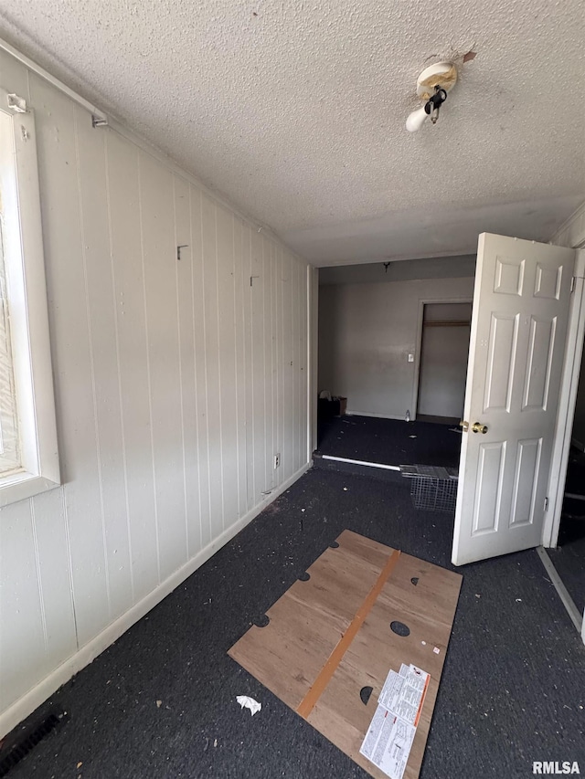 empty room with a textured ceiling