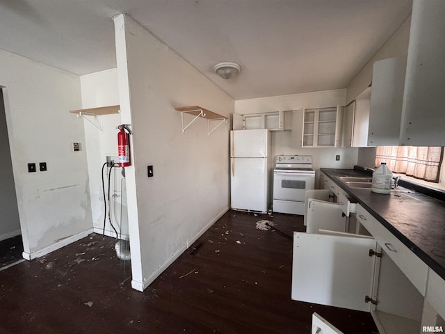 kitchen with white appliances, dark wood-type flooring, and white cabinets