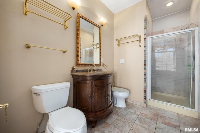 bathroom featuring vanity, toilet, and an enclosed shower