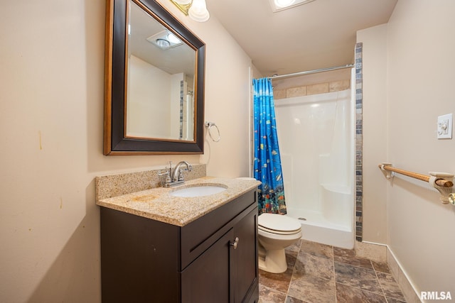 bathroom with vanity, toilet, and walk in shower