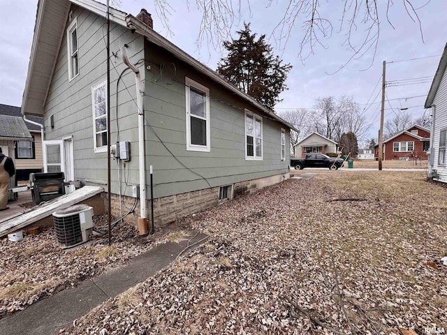 view of home's exterior featuring central AC