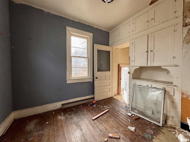 kitchen with white cabinets and dark hardwood / wood-style flooring