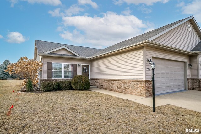 ranch-style home featuring brick siding, driveway, and a garage