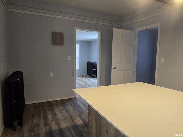 kitchen with dark hardwood / wood-style flooring