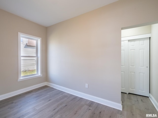 unfurnished room featuring light wood-type flooring