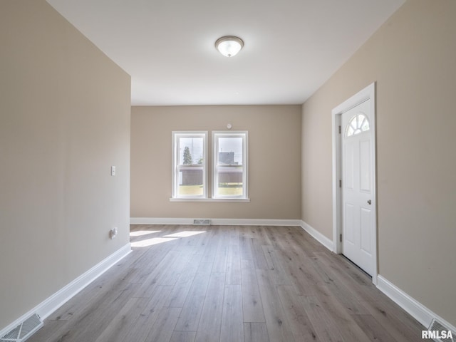 foyer entrance with light hardwood / wood-style flooring