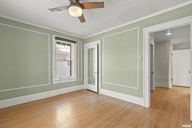 unfurnished bedroom with crown molding, light hardwood / wood-style floors, and ceiling fan