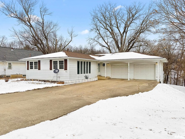 single story home featuring driveway and an attached garage