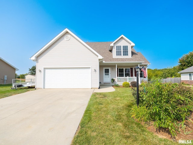 cape cod home with a garage, covered porch, and a front lawn