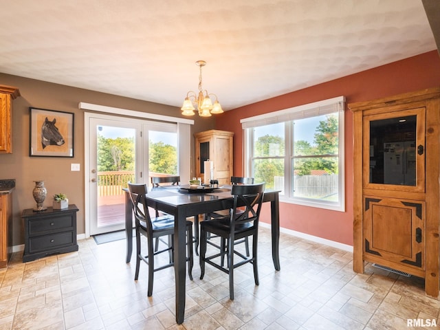 dining room with a chandelier