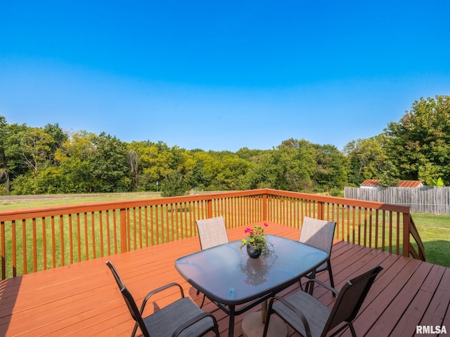 wooden terrace with a yard