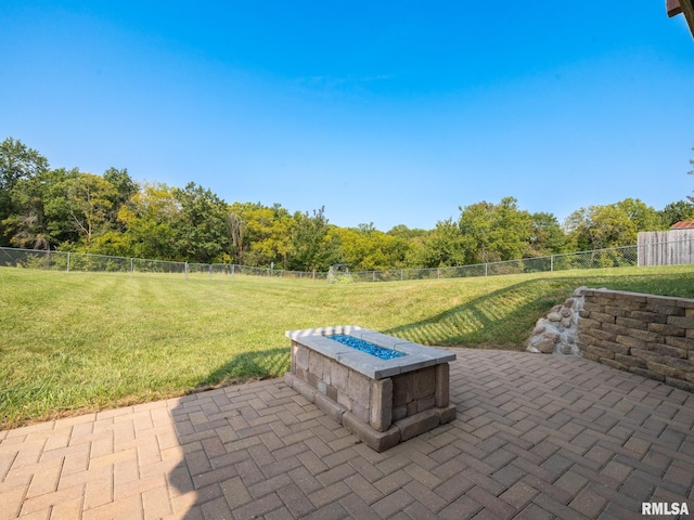 view of patio with a fire pit