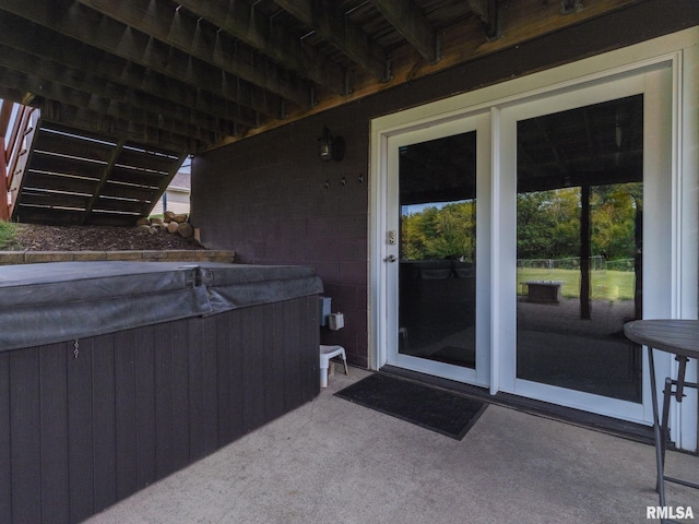 entrance to property with a hot tub