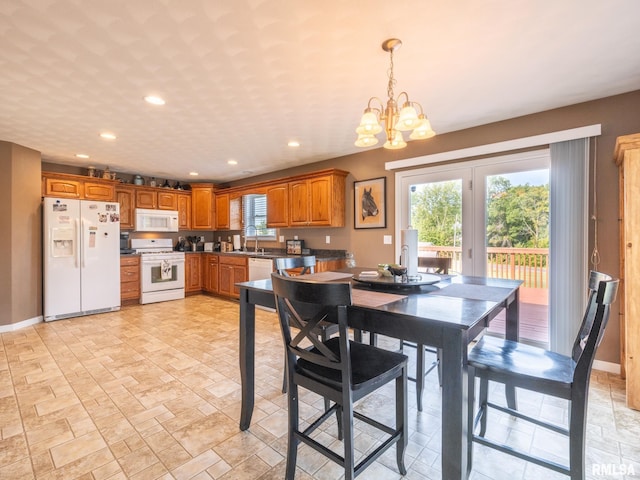 dining area featuring a notable chandelier