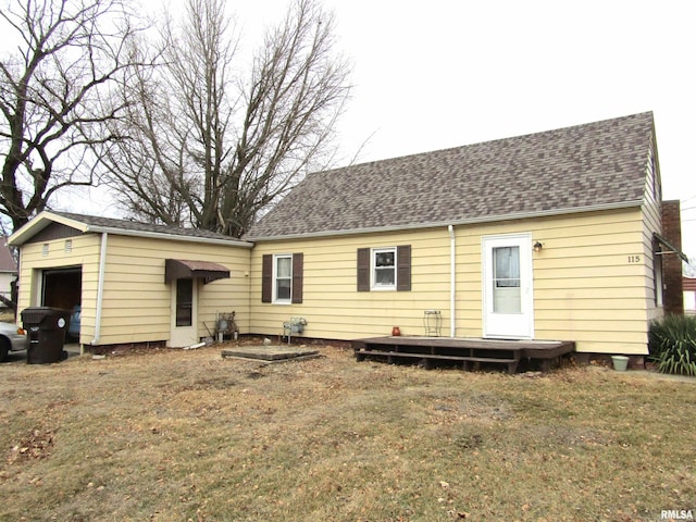 rear view of house with a yard