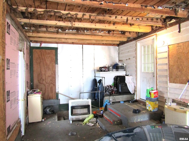 interior space with washer / clothes dryer and heating unit