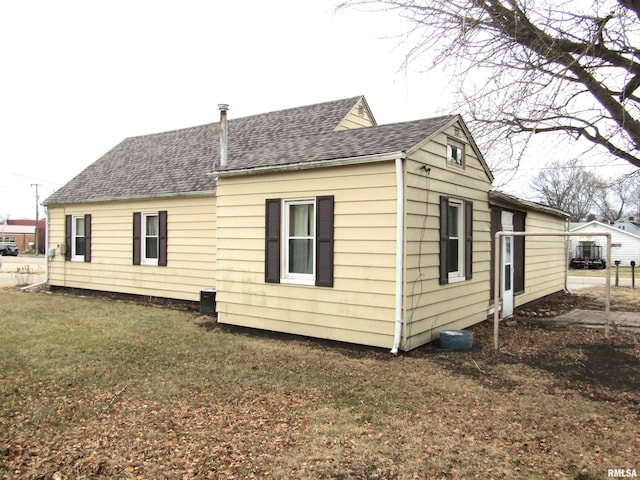 view of home's exterior with a yard