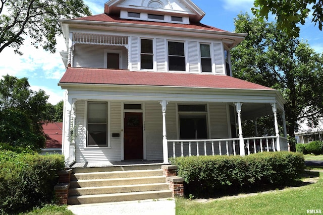 view of front of property featuring covered porch