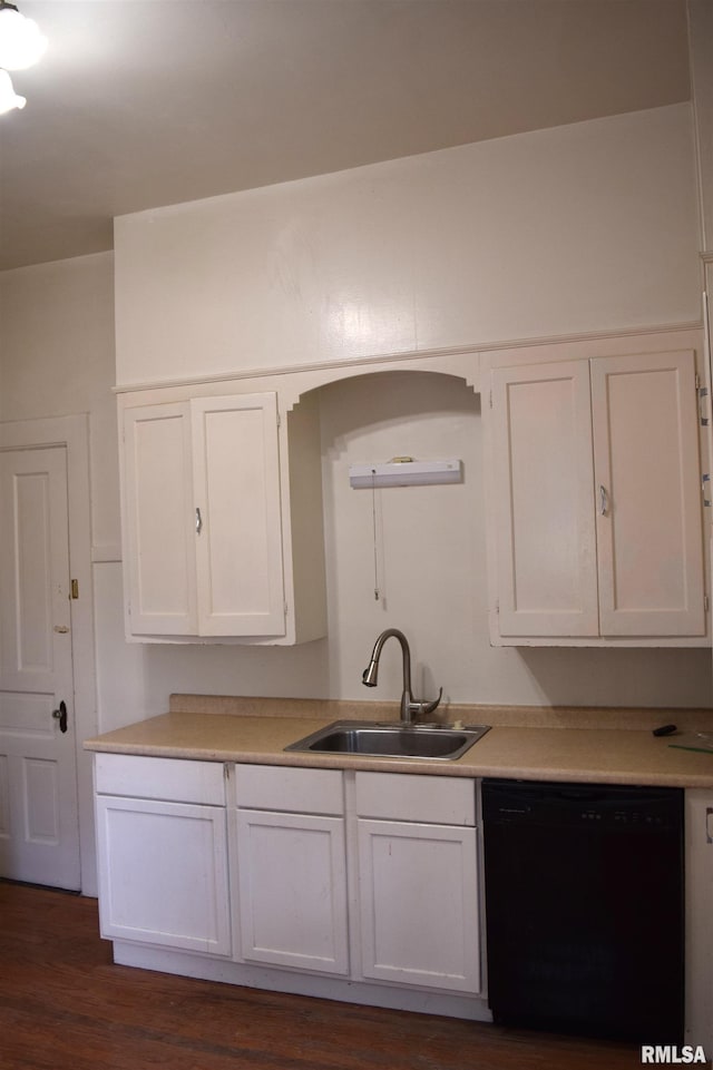 kitchen featuring dark hardwood / wood-style flooring, sink, white cabinets, and dishwasher