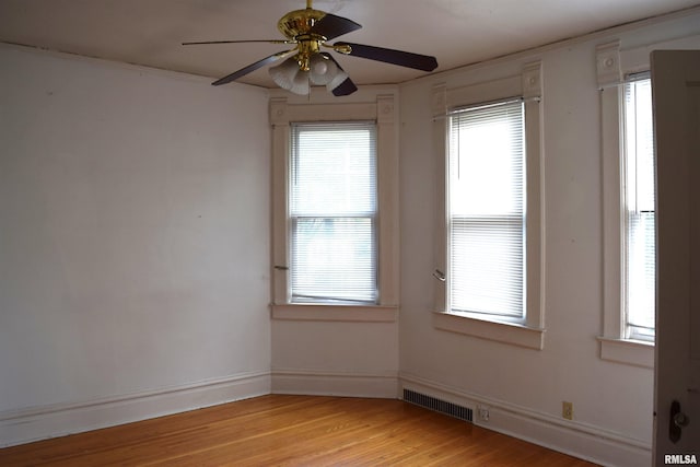 empty room with light hardwood / wood-style floors and ceiling fan