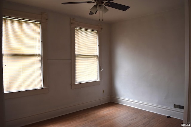 spare room featuring hardwood / wood-style flooring and ceiling fan