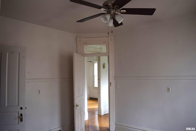 spare room with ceiling fan and light hardwood / wood-style flooring