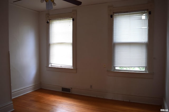 unfurnished room featuring light hardwood / wood-style flooring and ceiling fan