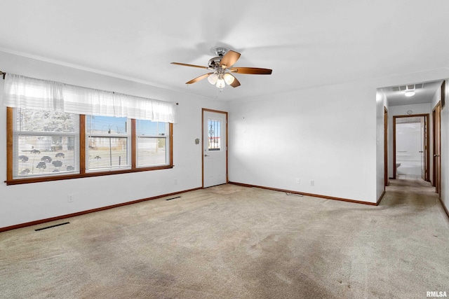 unfurnished room featuring ceiling fan and light colored carpet