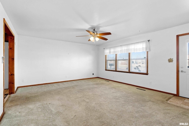 empty room with ceiling fan and carpet floors