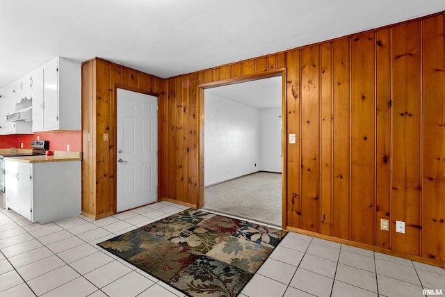 tiled entrance foyer with wooden walls