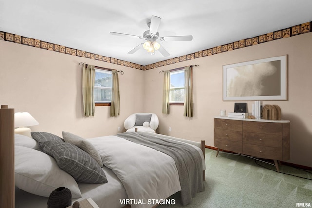 bedroom with light colored carpet and ceiling fan