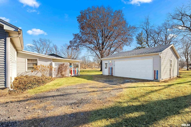 view of yard with a garage and an outdoor structure