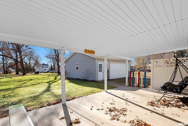 view of patio / terrace featuring a garage