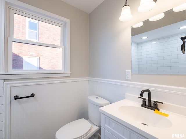 bathroom with vanity and toilet