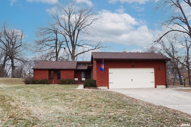 ranch-style house featuring a garage and a front lawn