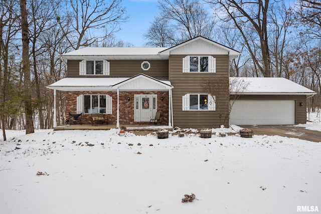 traditional home featuring a garage and brick siding